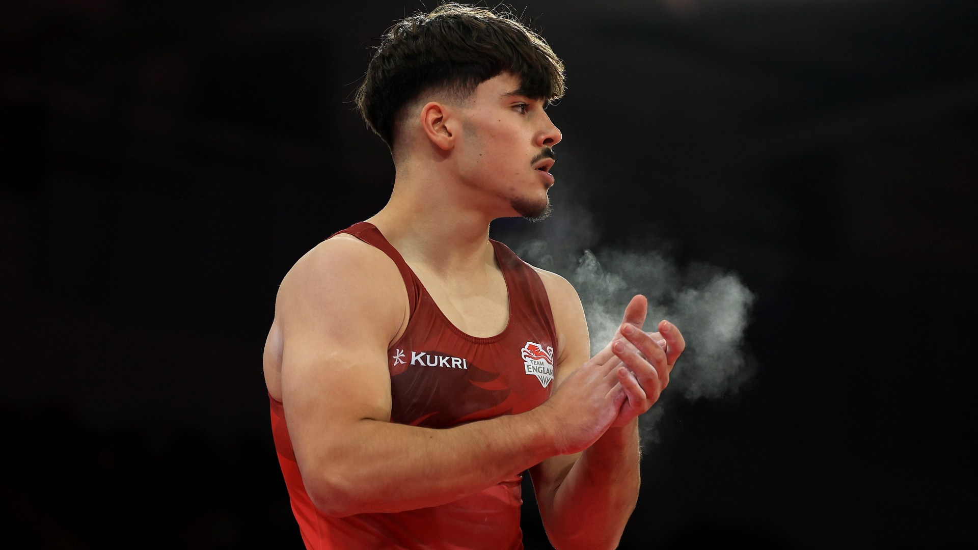 England's Gabriel Langton Suffers High Bar Fall at Commonwealth Games, Team Secures Silver.