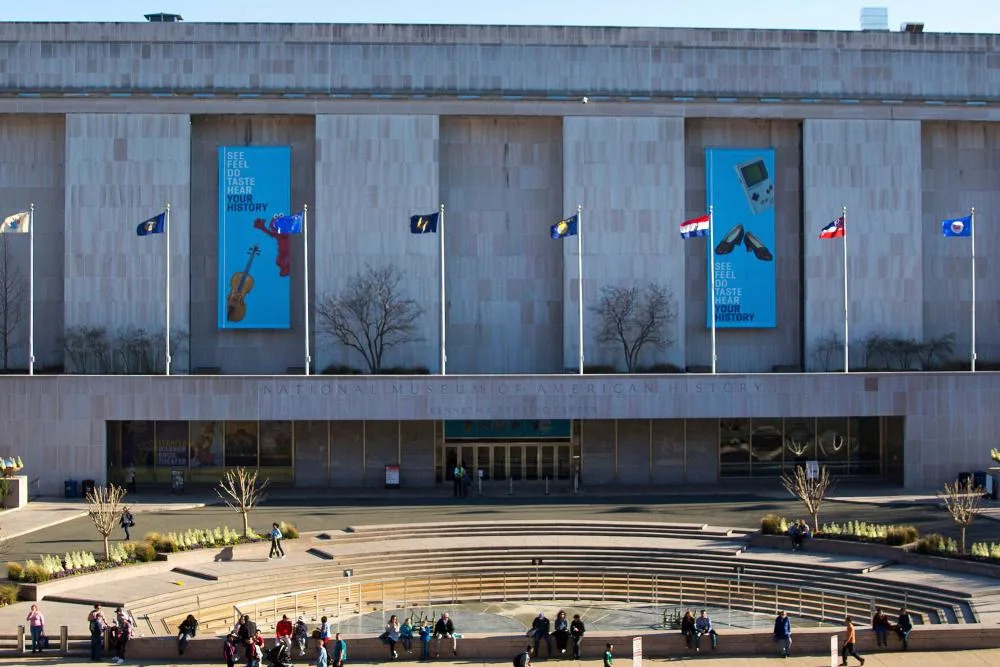 Trump orders signs outside Smithsonian history museum criticizing its historical focus.