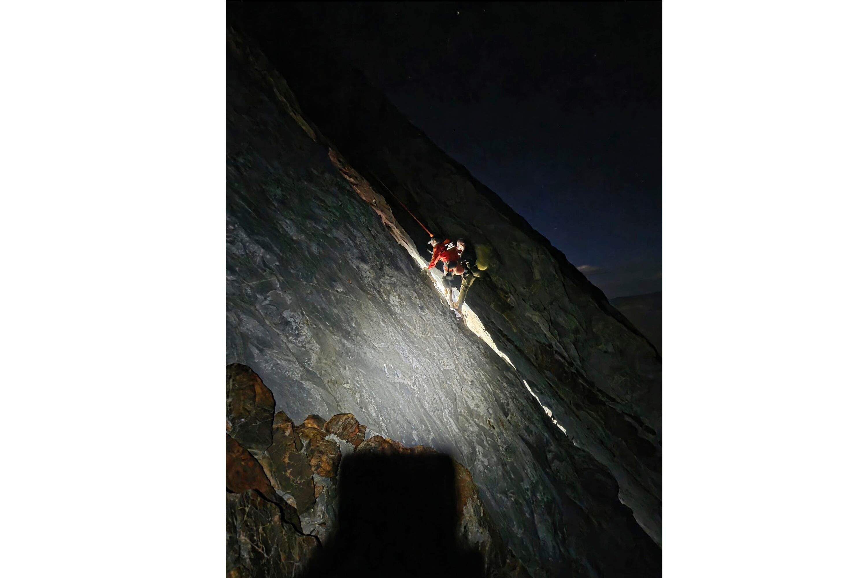 Volunteers rescue a stranded climber from a narrow ledge in the Sierra Nevada after fifteen hours.