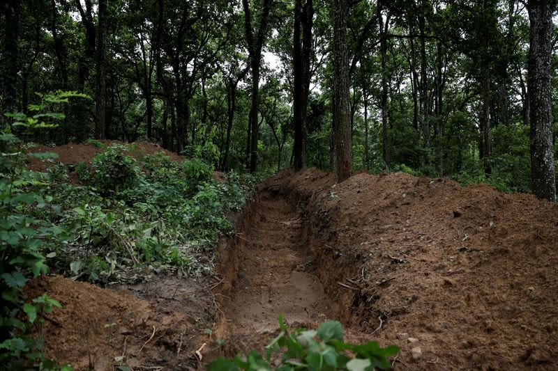 Nepal begins mass burials for unidentified flood victims as families seek missing