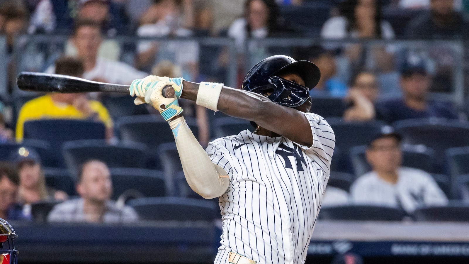 Yankees beat Red Sox 9-2 to split doubleheader and extend wild-card lead.
