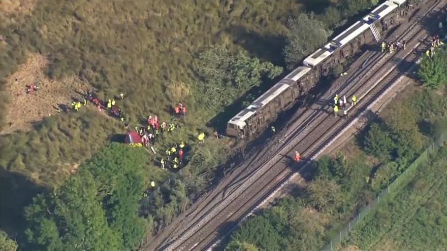 Passenger train derails in England, causing line closures and significant rail delays.