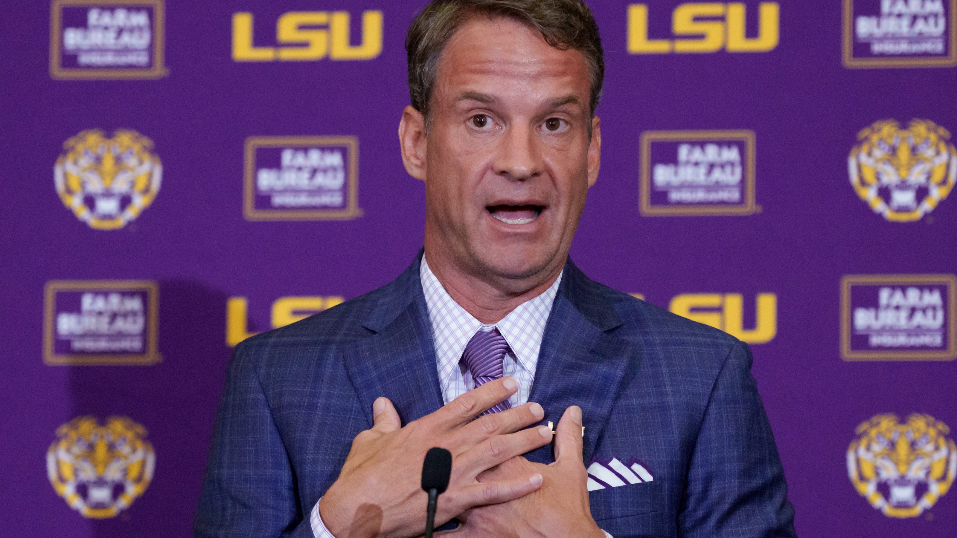 LSU challenges SEC authority by signing former NFL players amid ongoing legal dispute.
