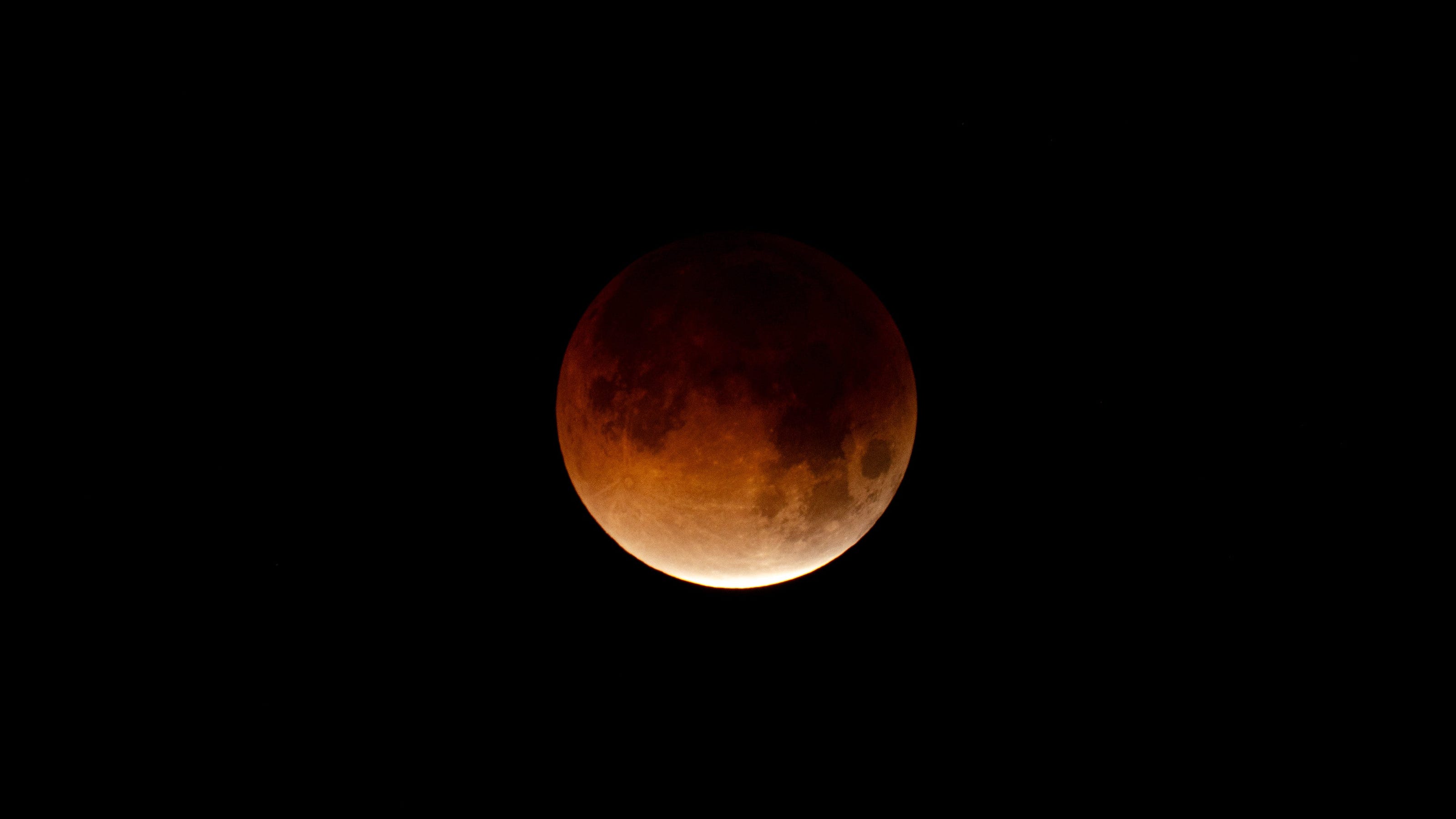 A near-total partial lunar eclipse will peak at midnight and remain visible across the US.