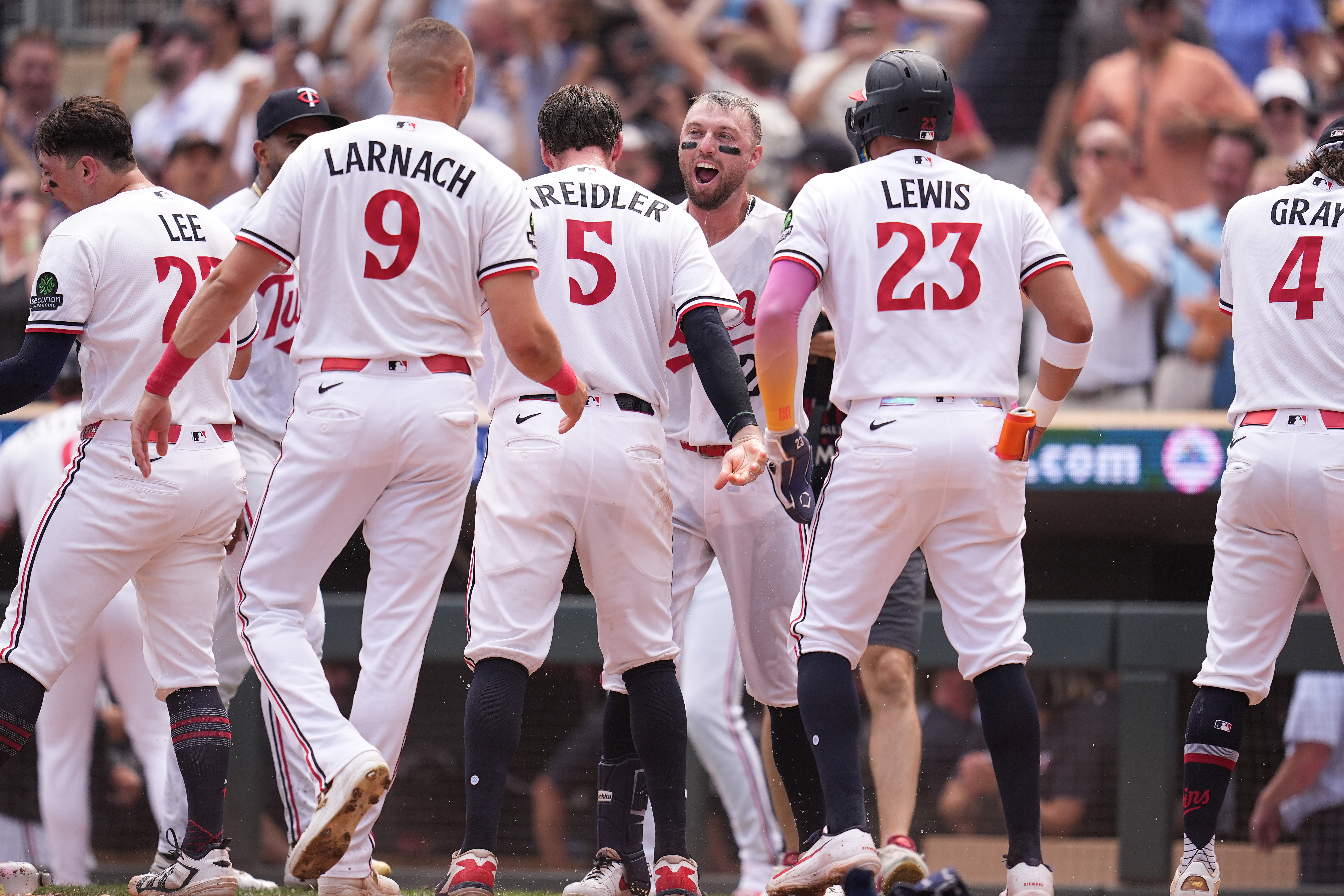 Homer-fueled Twins offense climbs above .500 for first time since April, tying for wild card.
