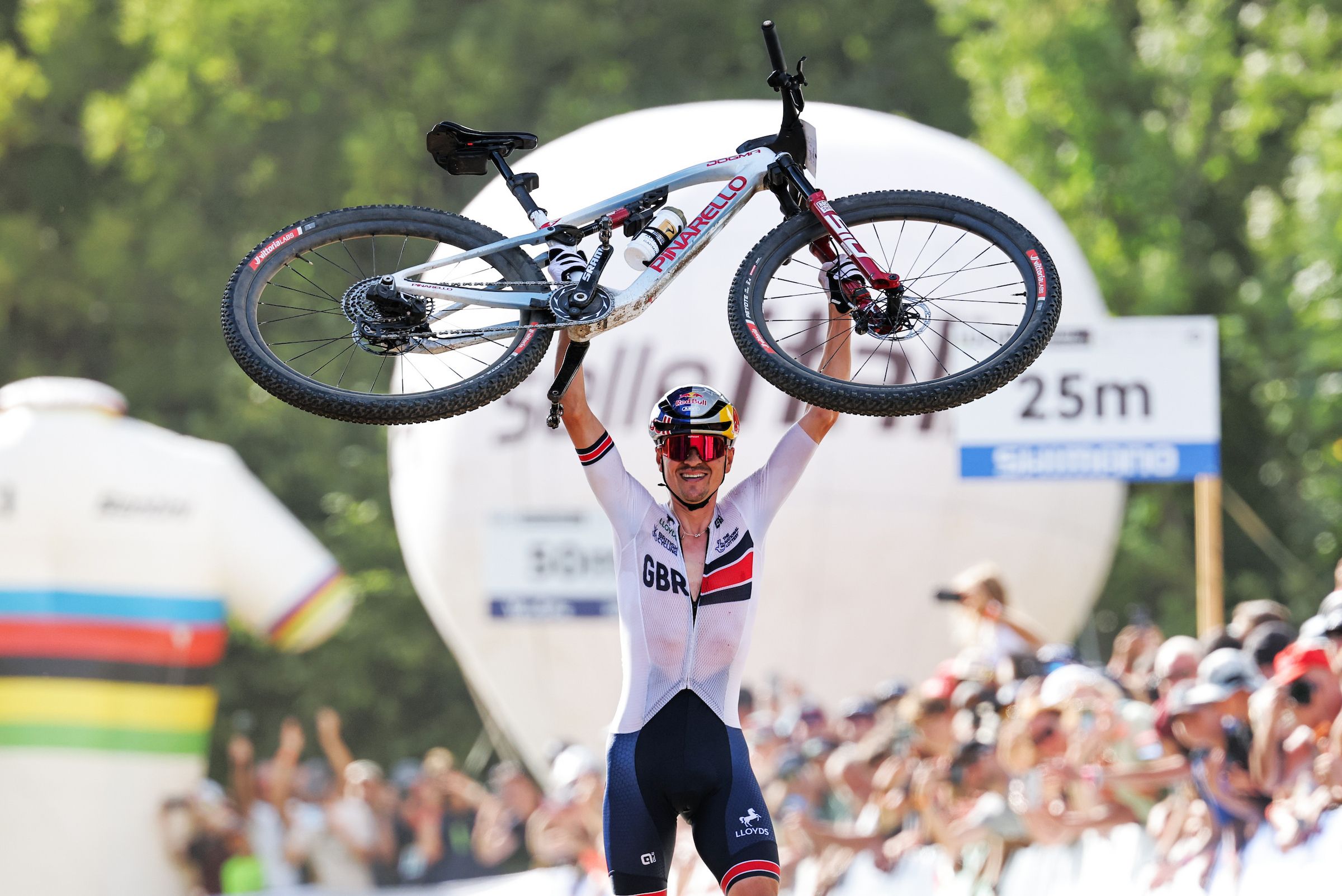 Tom Pidcock overcomes early setbacks and back pain to claim second mountain bike world title.
