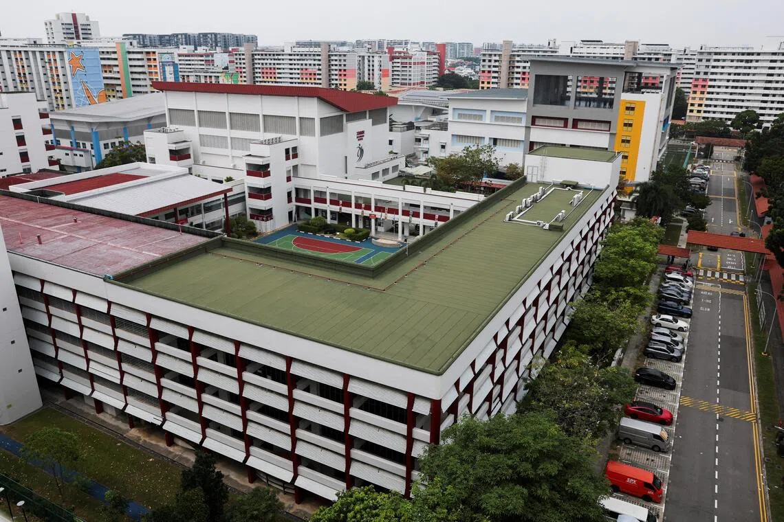 Xinmin Secondary School evacuates students over bomb threat; police find no suspicious items.