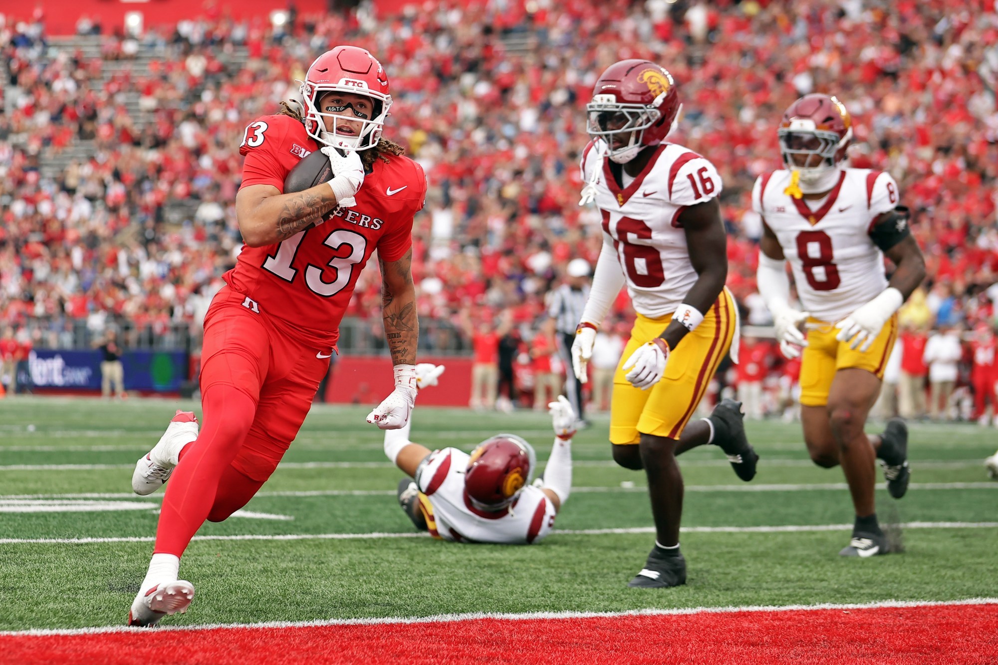 No. 12 USC Holds Off Rutgers 42-35