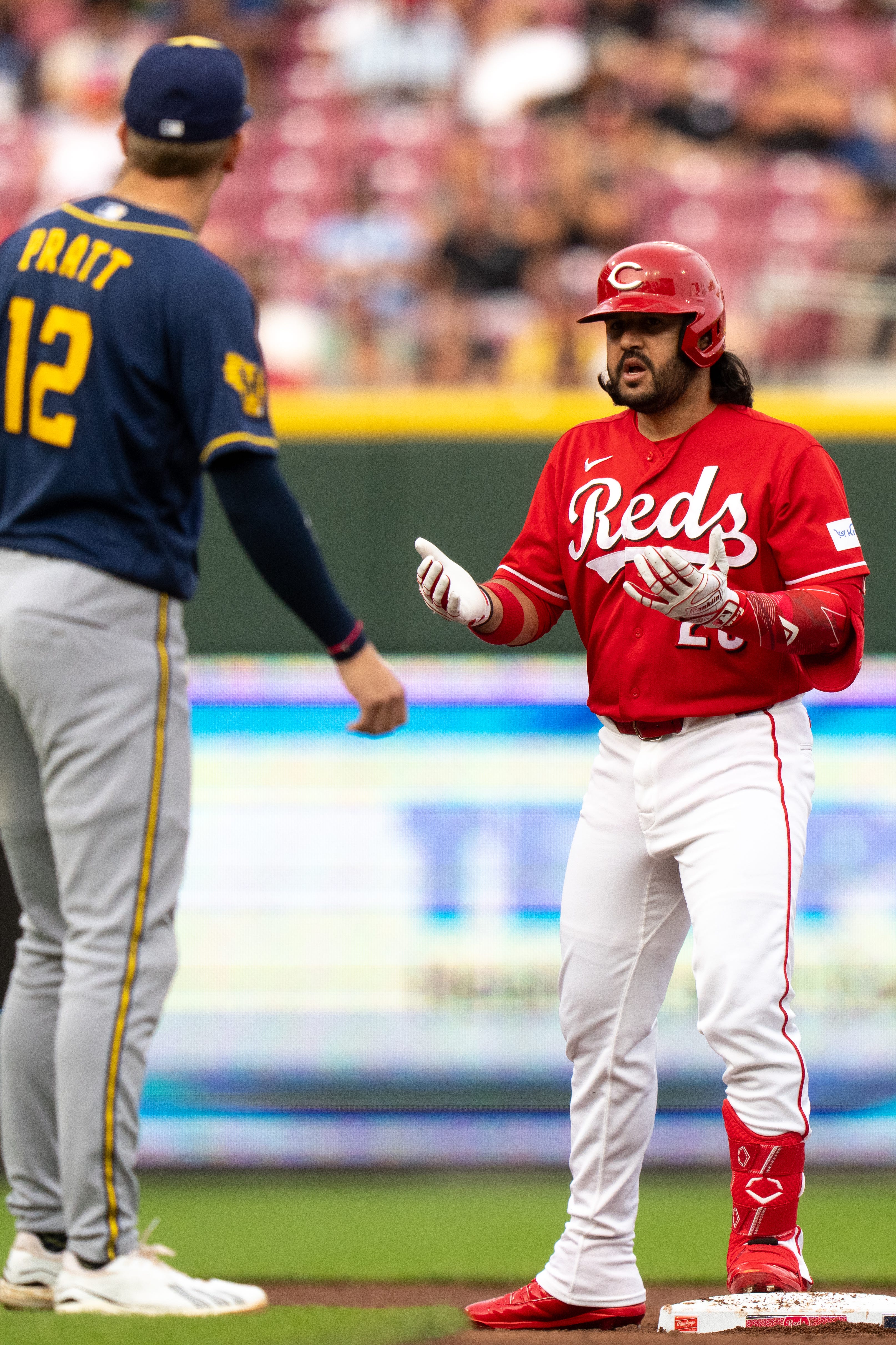 Rookie Cooper Pratt's bases-clearing triple rallies visiting Milwaukee Brewers past Cincinnati Reds.