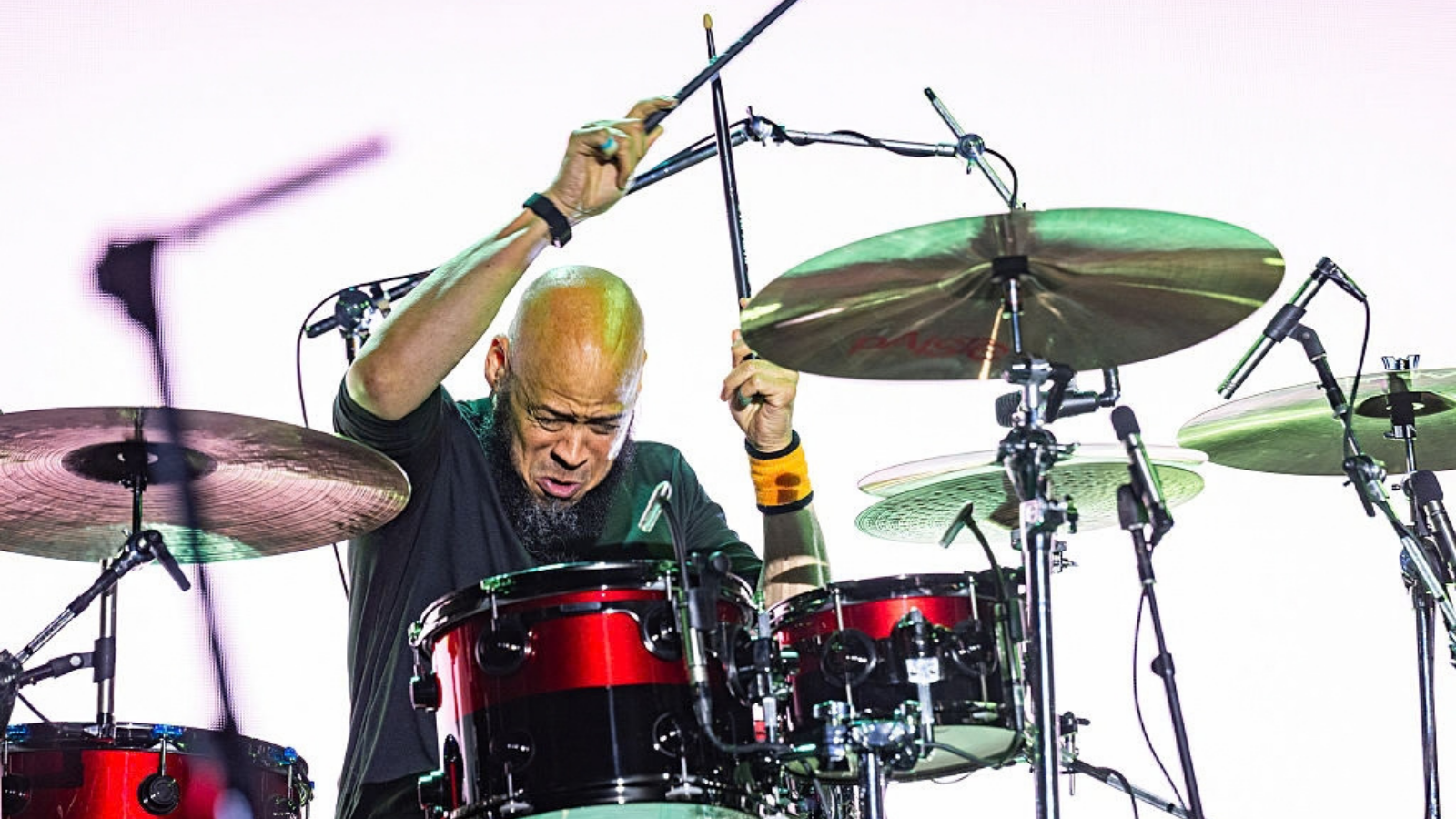 Pearl Jam surprises fans by debuting new drummer Abe Laboriel Jr. at festival.