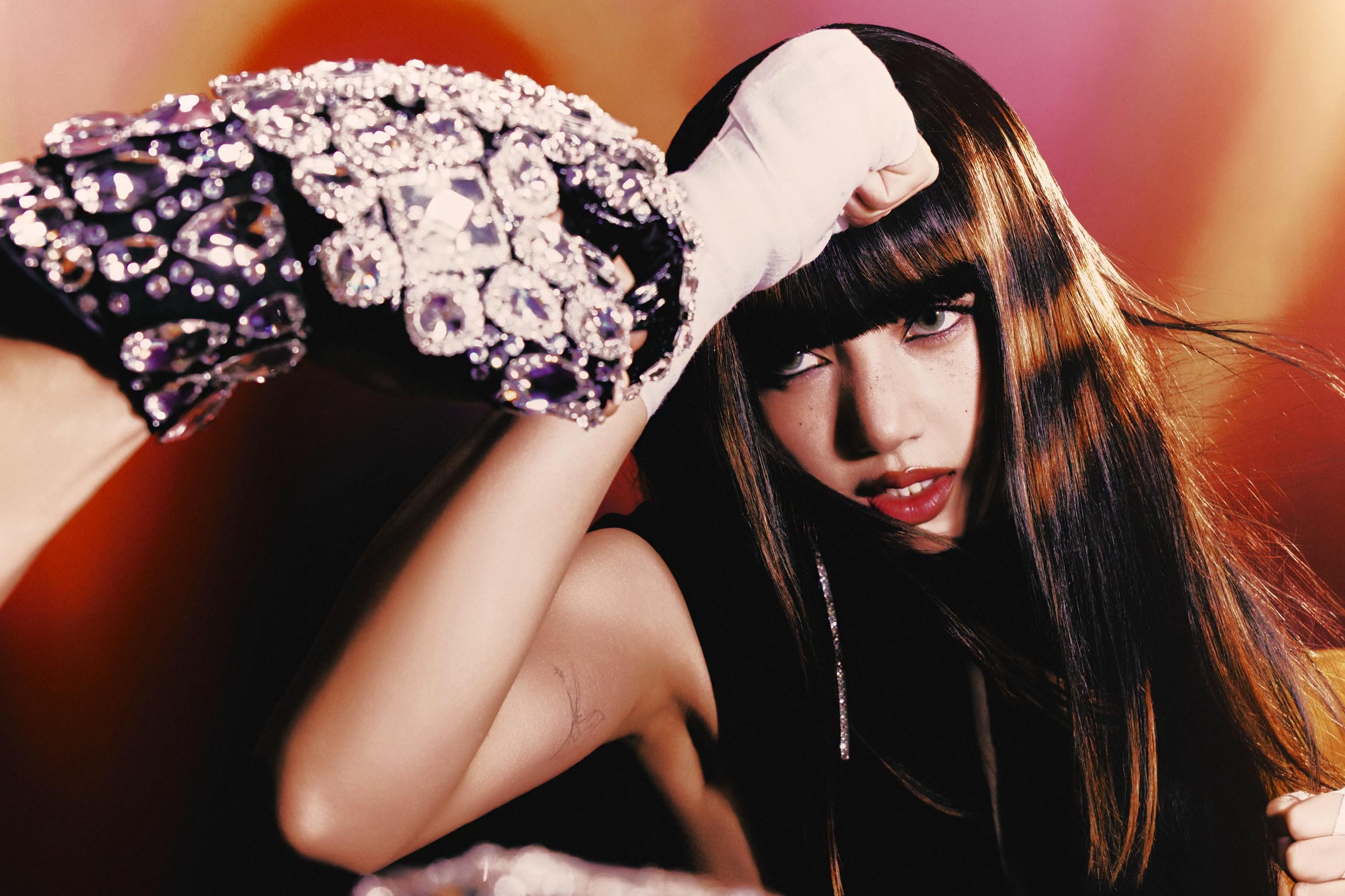 Blackpink's Lisa announces new feature documentary and upcoming Vegas residency plans.