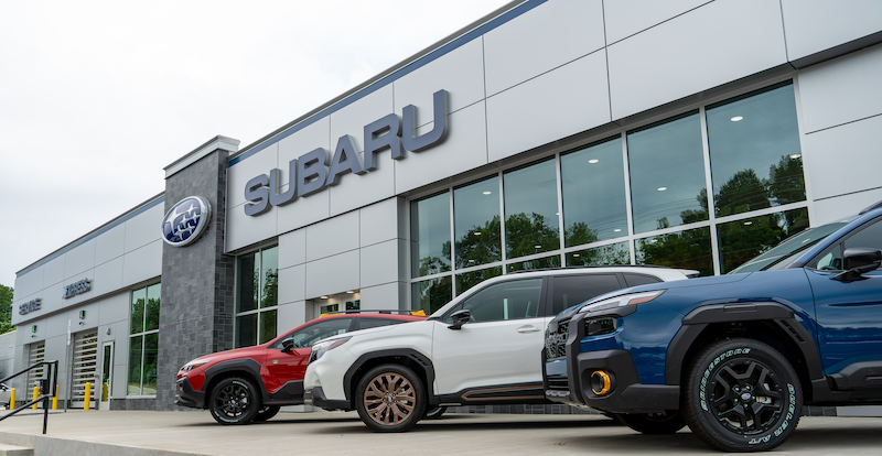 Dealership listings highlight new Subaru and Toyota vehicles featuring advanced safety and luxury options.