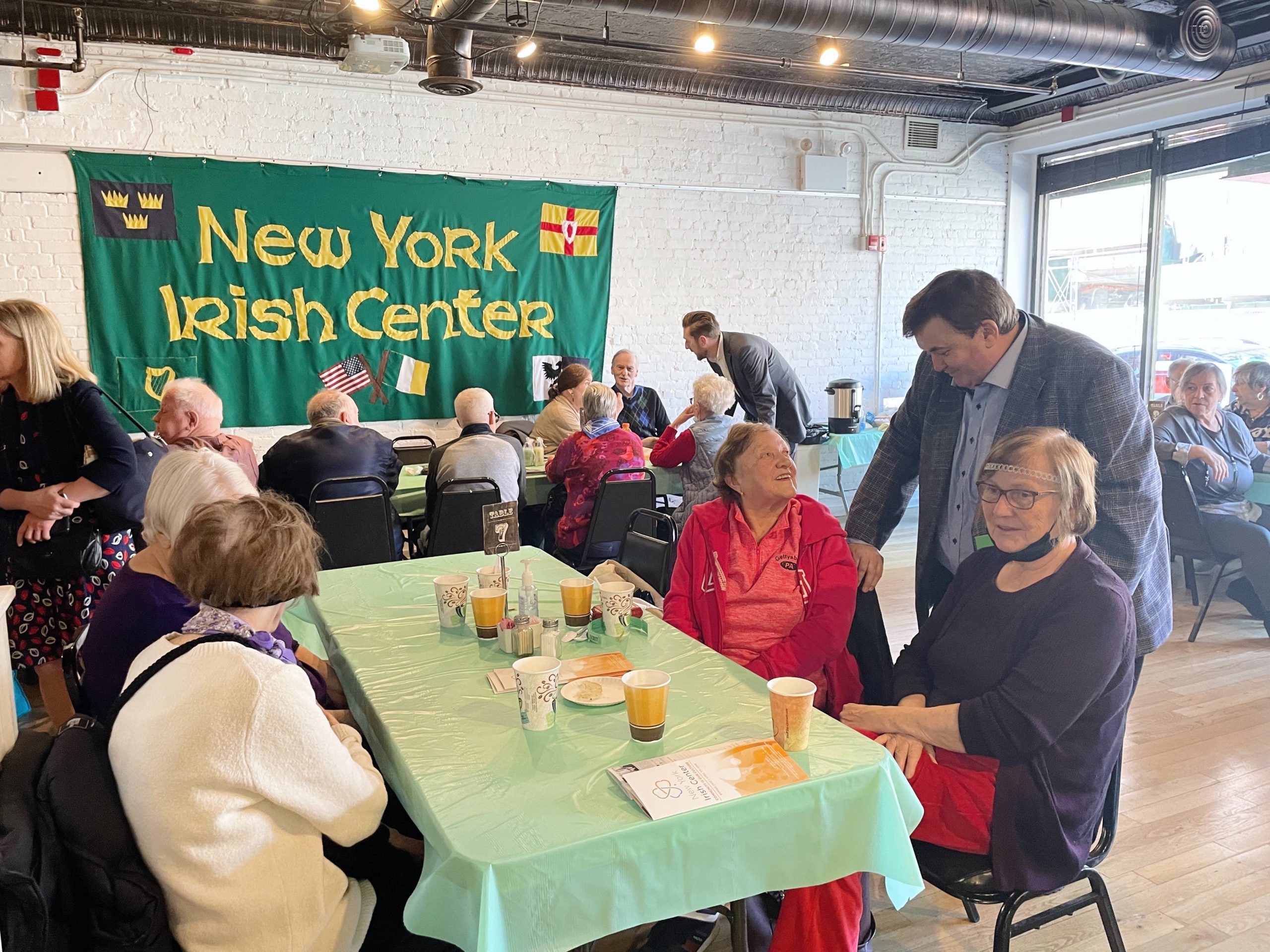 International news roundup covers Irish parade mediation, Michigan memorials, and urban planning initiatives.