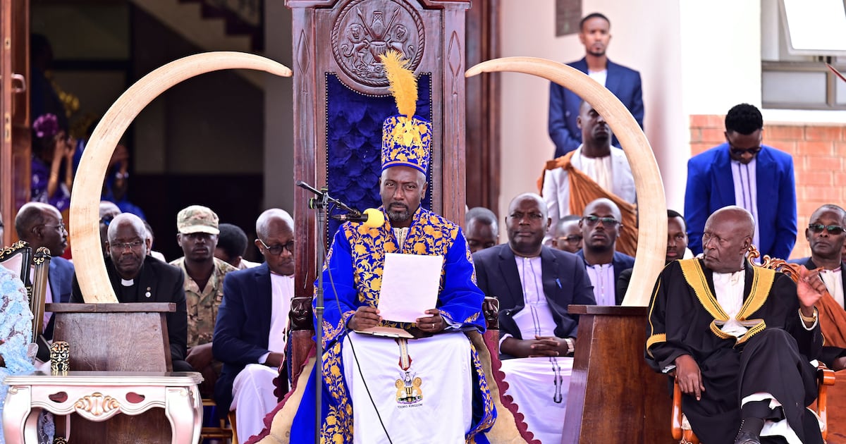Former television news anchor crowned king of Uganda's Tooro Kingdom following disputed succession.