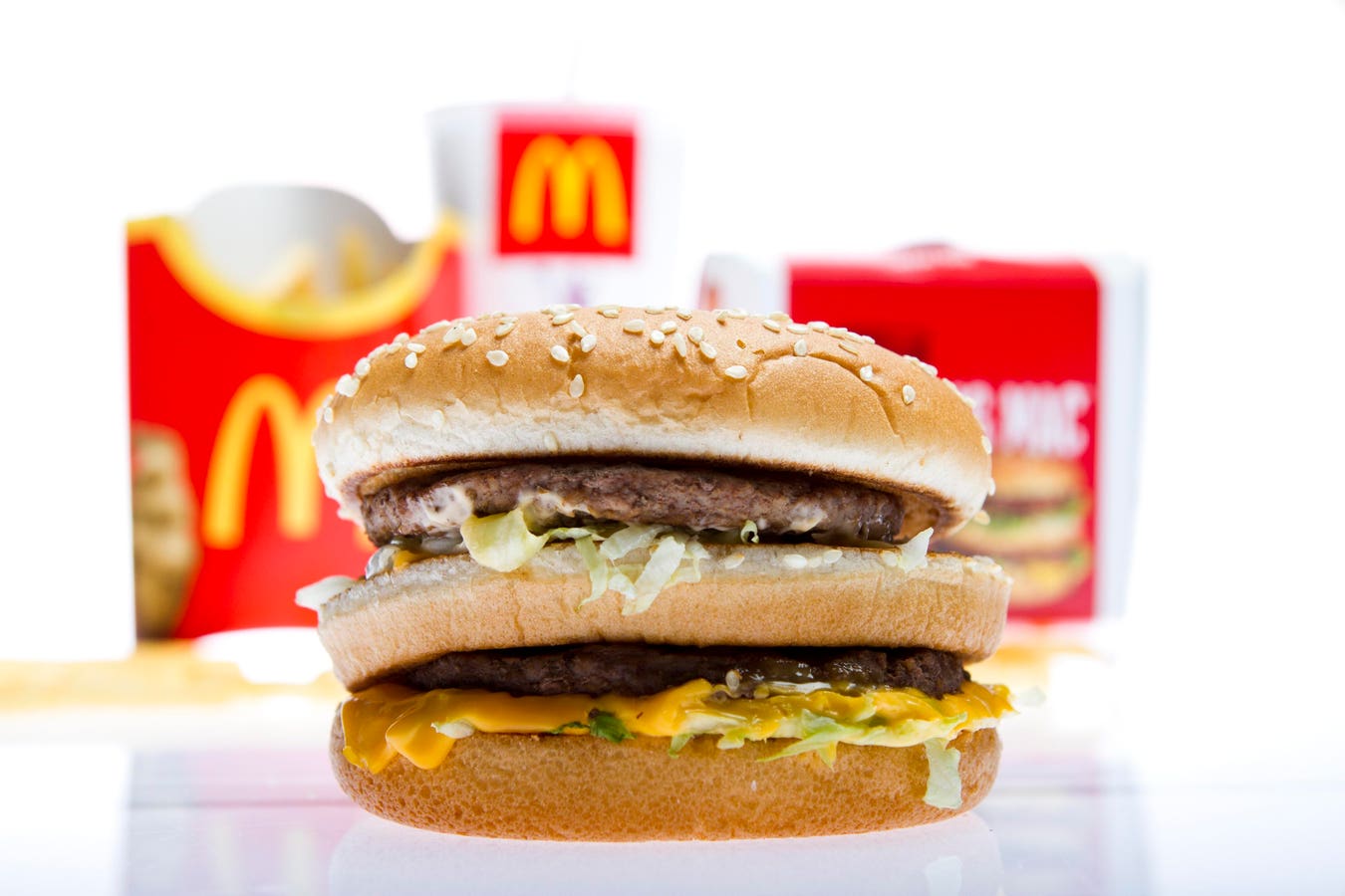 McDonald's shares slide near 52-week low as investors weigh aggressive new growth plans against slower sales.
