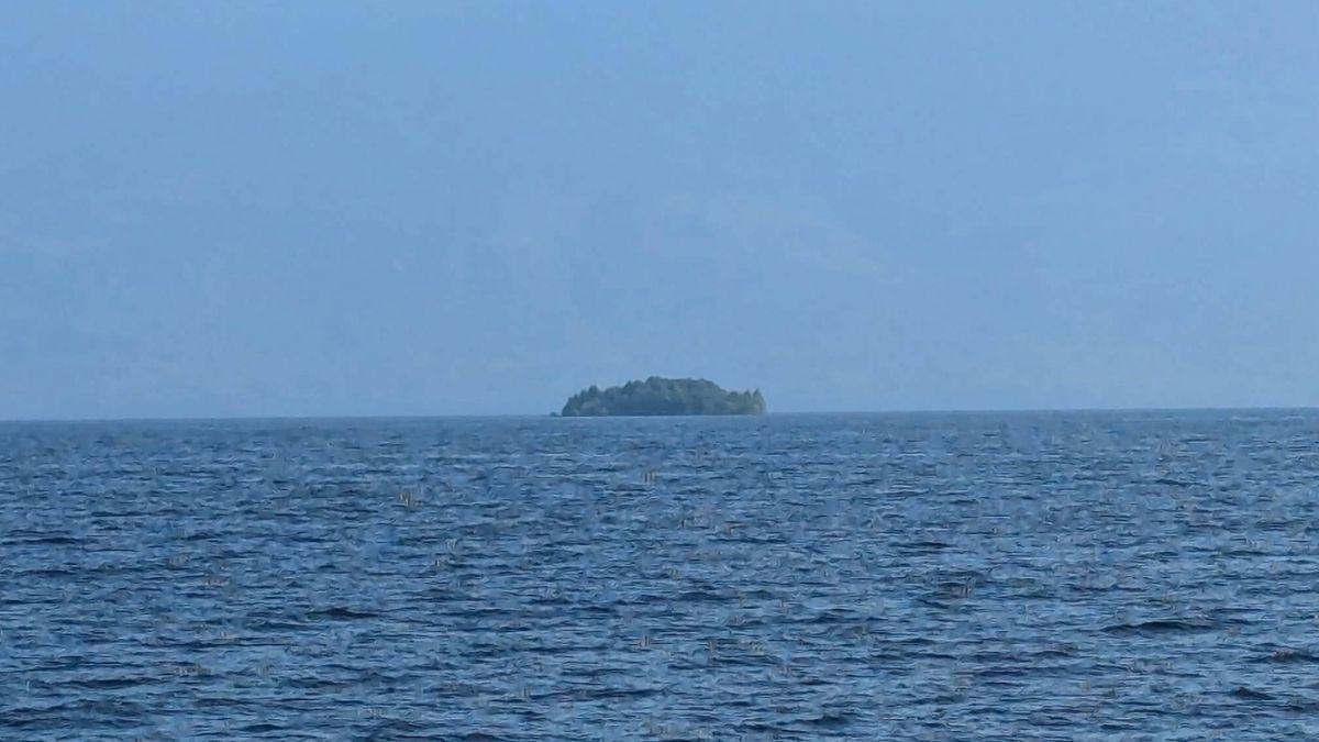 A mysterious vegetated island mysteriously emerges and disappears across a Canadian lake
