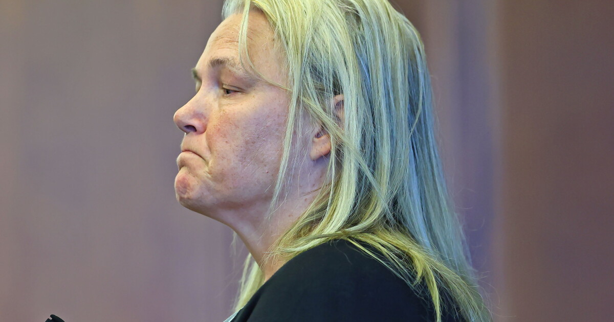 Woman accused of trying to intimidate jurors in high-profile murder trial.