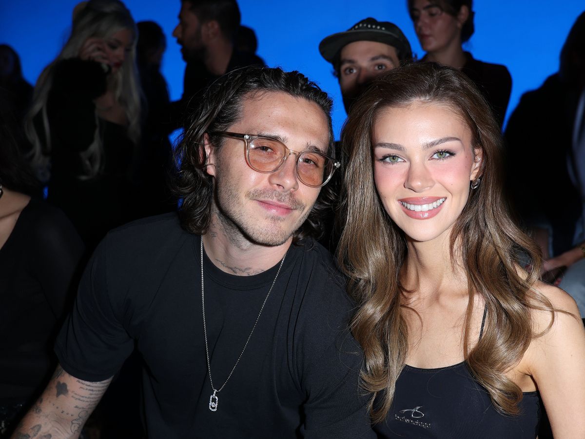 Brooklyn Beckham and Nicola Peltz attend Paris fashion shows amid ongoing family feud.