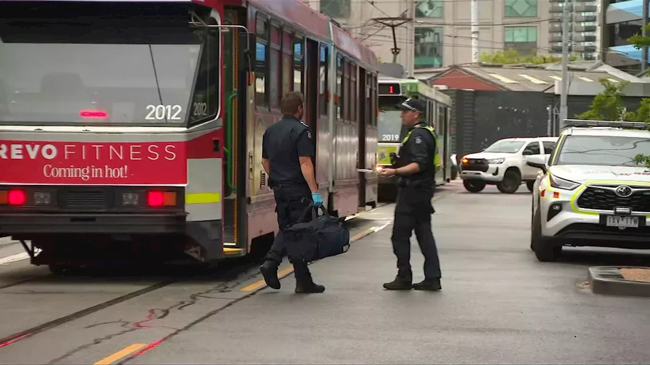 Woman stabbed in the neck on moving Melbourne tram by fleeing suspect