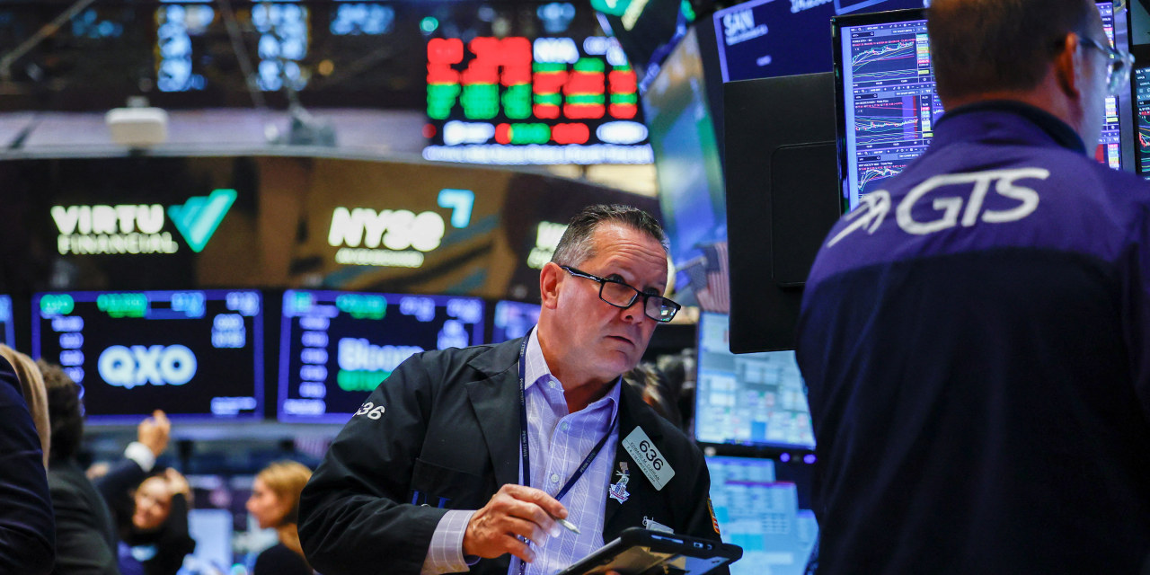 US stocks rise toward all-time highs driven by recent major market buyouts.