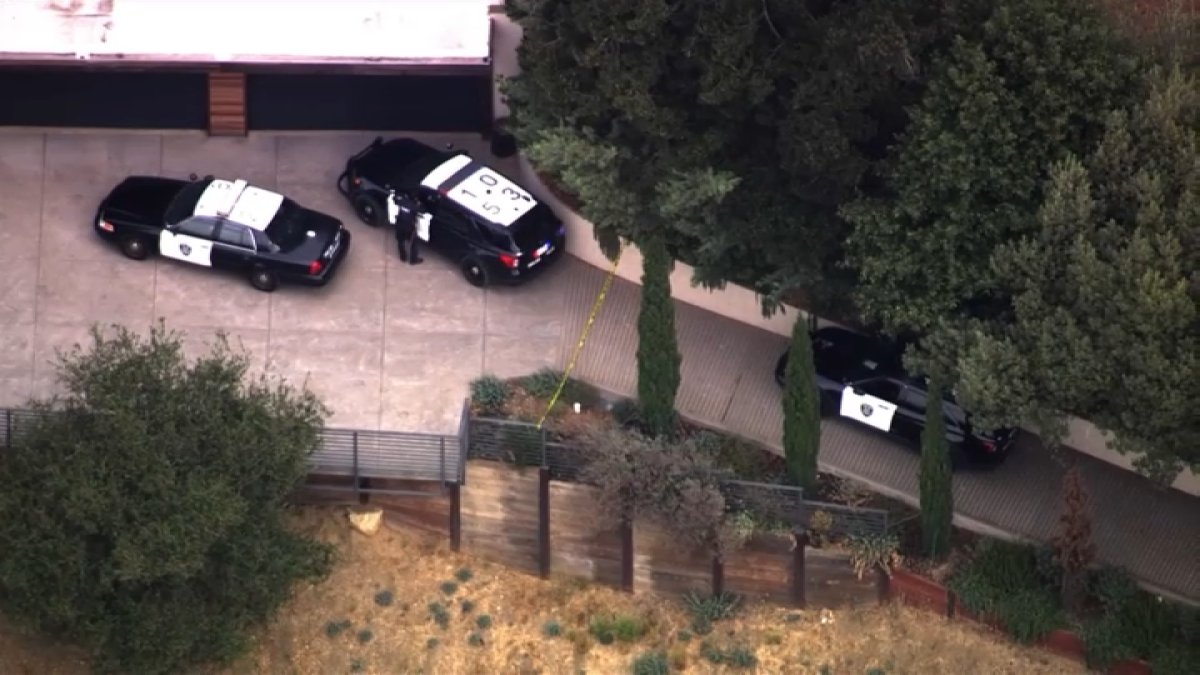 Two people were fatally shot near the Oakland-Berkeley border, and one suspect is in custody.