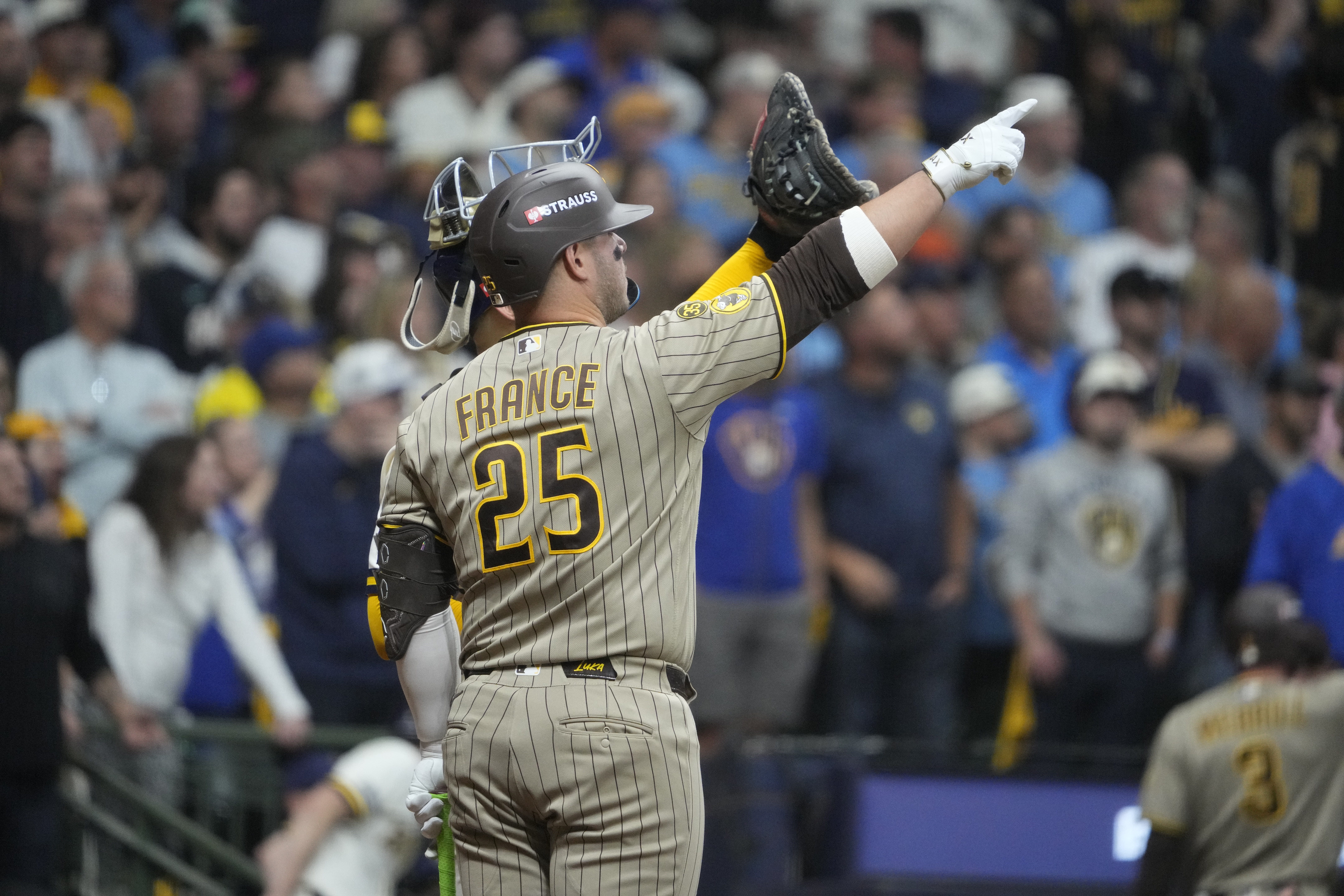 Brewers defeat San Diego in NLDS opener following a bizarre roof play.
