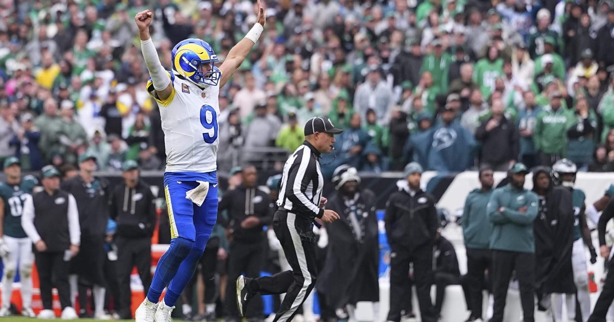 Rams overcome early offensive struggles to defeat the Philadelphia Eagles 24-20 in rain.