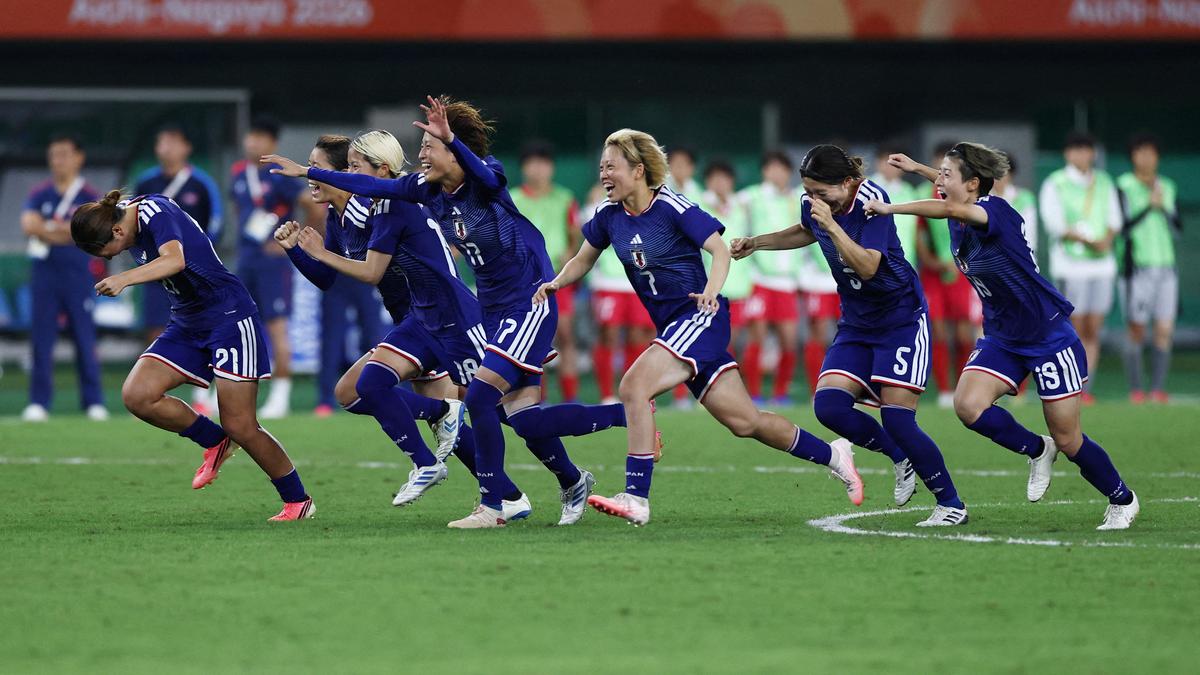 Japan defeats North Korea on penalties to secure third consecutive Asian Games soccer gold.