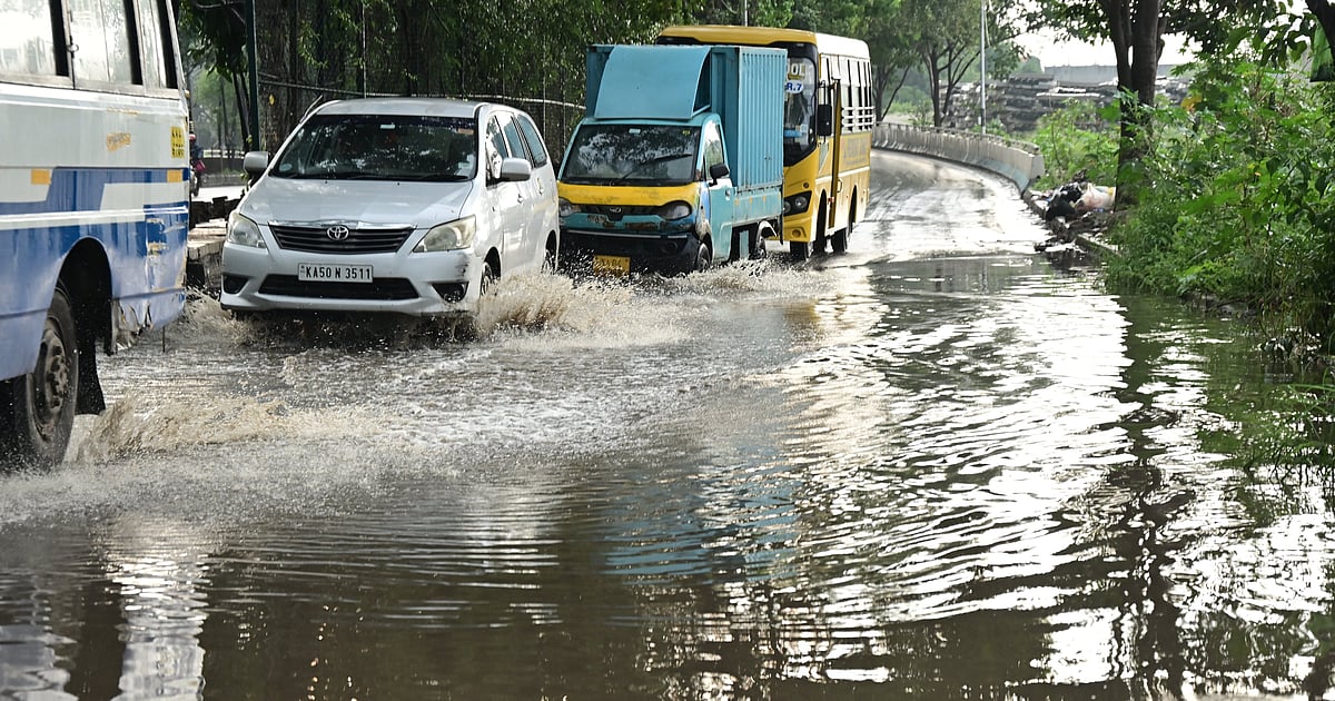 Heavy Rains Flood Bengaluru Roads and Disrupt Peak-Hour Traffic Across the City