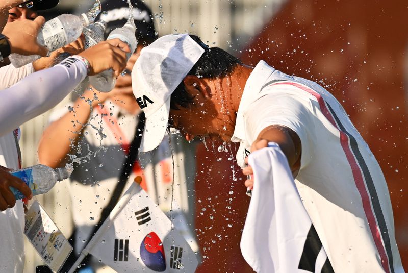 Tom Kim wins gold at the Asian Games, securing military service exemption for South Korea.