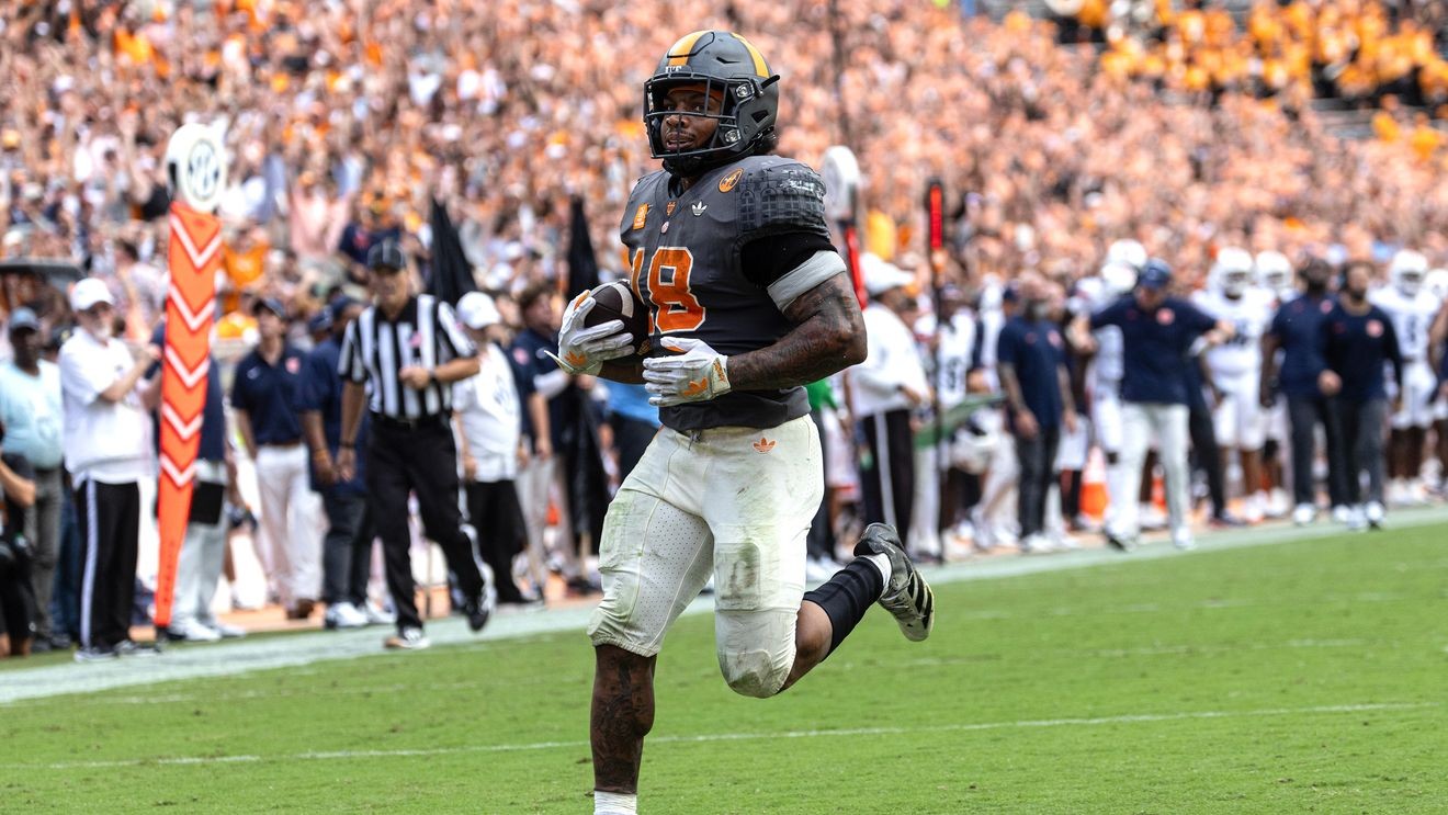 Bishop rushes for 220 yards and three touchdowns to lead Tennessee past Auburn